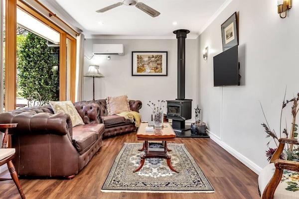 Stylish living space with forest views