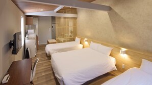 A hotel room with two beds, a desk, a chair, a TV, and a minibar. - Solana Smart INN Fuji Yamanakako (Yamanakako)