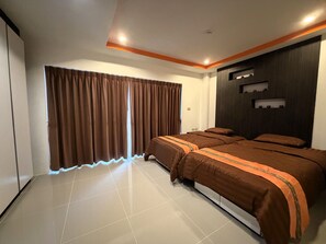 A modern bedroom with a large bed, curtains, and a wall-mounted shelf. - Pool-View Studio with Balcony - Nordic VIP 3, Pratumnak (Muang Pattaya)