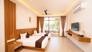 A hotel room with two beds, a TV, an air conditioner, and a balcony with curtains. - Malankara palace lake view resort & spa (Thodupuzha)