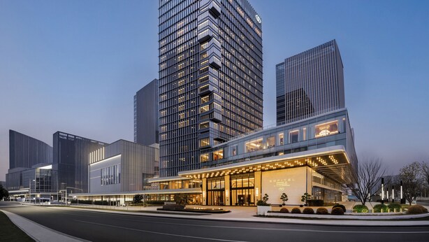 A modern hotel with a prominent entrance, multiple floors, and a well-lit facade. - Sofitel Changzhou Hi-tech District (Zhenjiang)