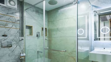 Shower, hair dryer, slippers, towels