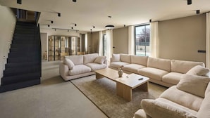A spacious living room with a staircase, a large window, and a modern design. - Villa with pool, only a few minutes from Poreč (Poreč)