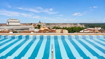 Seasonal outdoor pool, open 11:00 AM to 8:00 PM, pool umbrellas