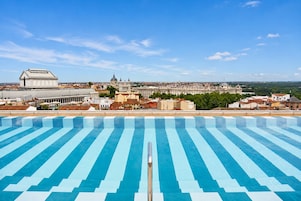 Seasonal outdoor pool, open 11:00 AM to 8:00 PM, pool umbrellas