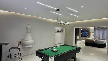 Deluxe Apartment, Balcony, City View | Games room