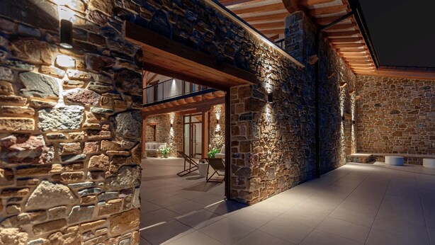 A stone-walled building with a covered outdoor area and a wooden ceiling. - Rural house ORUE BASERRIA in URDAIBAI-with jacuzzi and sauna (Ajuria)
