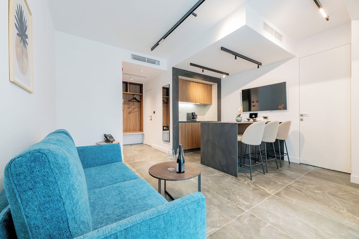 Superior Apartment | Living area | 42-inch Smart TV with digital channels