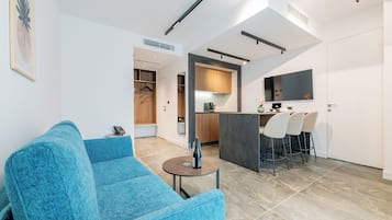 Superior Apartment | Living area | 42-inch Smart TV with digital channels