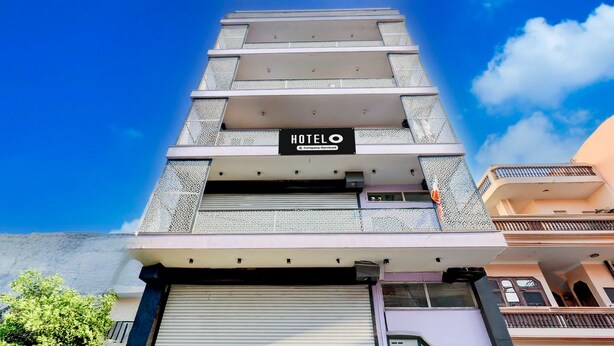 A hotel with a sign reading "HOTELO & Company Services" on the facade. - Super Hotel O Sadar Bazar Gurgaon (Gurugram)