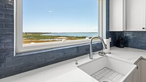 Interior - Double the luxury at our 4BR Waterfront Duo! Combining units 301 & 401, you get 2 kitchens, 2 living areas, and stunning SPI marina views. Perfect for large families seeking space and privacy with concierge service. (SOUTH PADRE ISLAND)