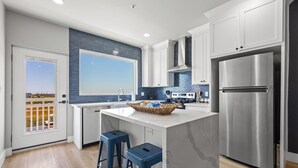 Private kitchen - Double the luxury at our 4BR Waterfront Duo! Combining units 301 & 401, you get 2 kitchens, 2 living areas, and stunning SPI marina views. Perfect for large families seeking space and privacy with concierge service. (SOUTH PADRE ISLAND)