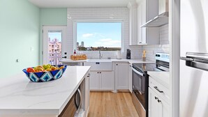 Private kitchen - Double the luxury at our 4BR Waterfront Duo! Combining units 301 & 401, you get 2 kitchens, 2 living areas, and stunning SPI marina views. Perfect for large families seeking space and privacy with concierge service. (SOUTH PADRE ISLAND)