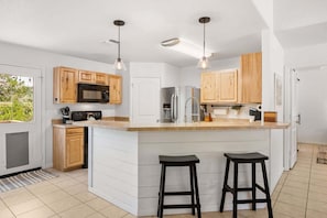 Fridge, microwave, oven, stovetop - Canyon Cottage: Hill Country Getaway, Hot Tub & Fire Pit, Mins to Whitewater Amphitheater & Tubing (Canyon Lake)