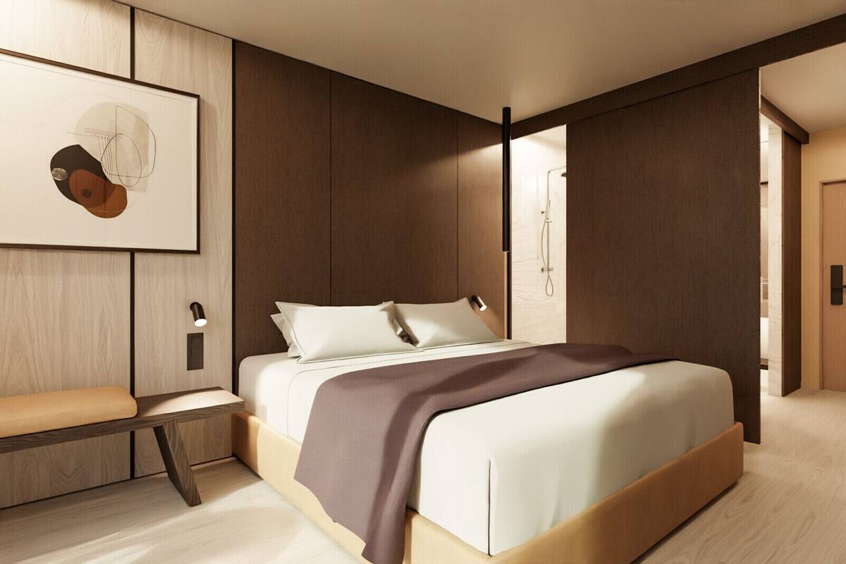 A modern bedroom with a large bed, a bedside table, a bench, and a framed artwork on the wall.