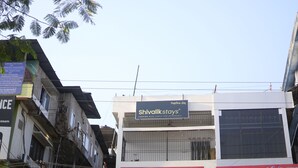 A building with a sign for 'Shivalik stays' indicating it is a lodging facility. - Shivalik stays  (East Jorhat)