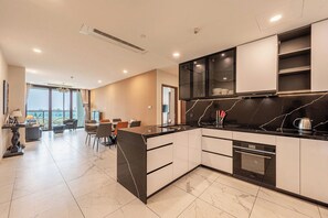 Deluxe Apartment, 3 Bedrooms, Balcony | Private kitchen | Full-size fridge, microwave, oven, stovetop - GALLERIA Premier Residence (Thu Thiem)