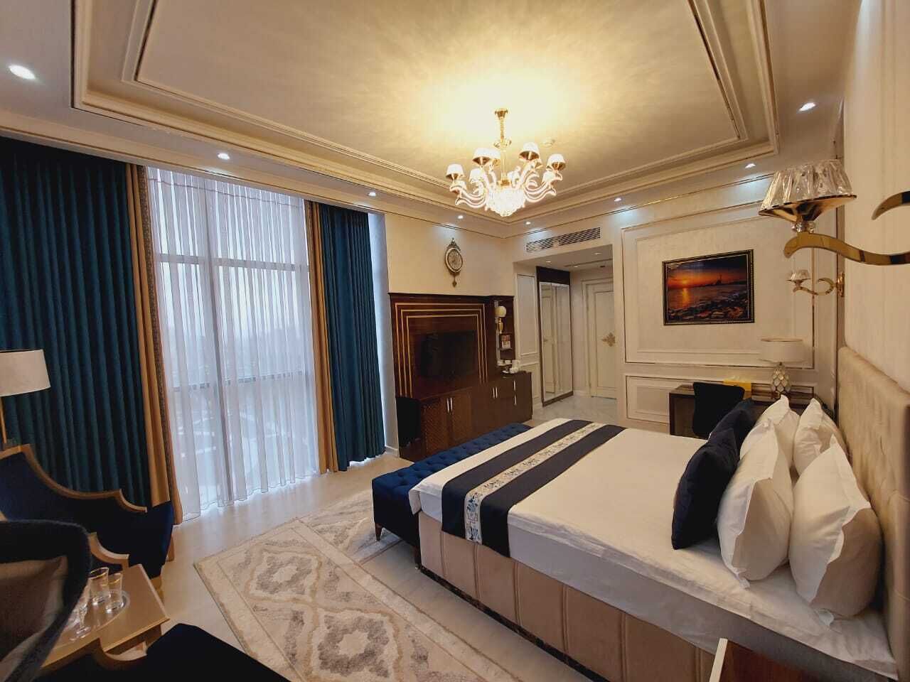 Deluxe Room, City View | In-room safe, desk, laptop workspace, blackout drapes