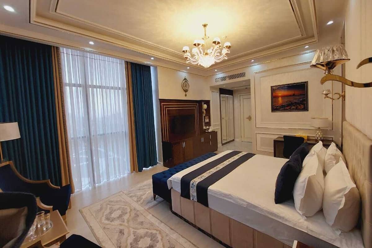 Deluxe Room, City View | In-room safe, desk, laptop workspace, blackout drapes