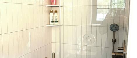 Shower, hair dryer, towels, soap