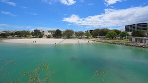 A coastal area with a sandy beach, calm turquoise waters, and a clear sky. - Waterfront Retreat-North Coogee, beachfront,Sauna, family friendly, Fremantle (North Coogee)