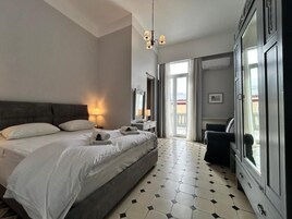 Deluxe Double Room, Balcony, Partial Ocean View | Blackout drapes, iron/ironing board, free cribs/infant beds, free WiFi