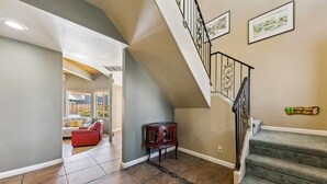 A staircase with a metal railing and a sign on the wall. - 2253 Catalina Drive 4 Bedroom Home (South Lake Tahoe)