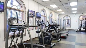 A gym with multiple treadmills, elliptical machines, and stationary bikes. - Rp216bd 3b Regal Palms Townhome 3 Bedroom Townhouse (Davenport)