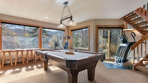 A pool table with stools, a treadmill, and a staircase. - Family-friendly Ski Escape With Hot Tub 4 Bedroom Condo (Park City)