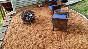 A house with a covered patio area, outdoor furniture, and a grill. - Cabin with private dock/beach access to Lake Minnewaska (Glenwood)