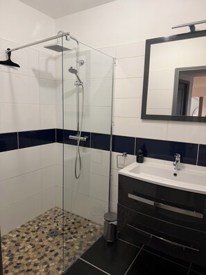 Shower, hair dryer, towels, soap