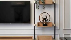 A wall-mounted TV with three wooden storage units below it. - Daphne Pera; Jasmin Apart, City Center (Beyoglu)