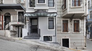 A building with a sign reading "THE ONE TAKSIM" above the entrance. - The One Taksim 105 Room, Comfort & Privacy (Beyoglu)