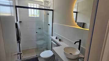 Shower, hair dryer, towels, toilet paper