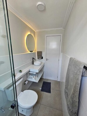 Shower, hair dryer, towels, toilet paper