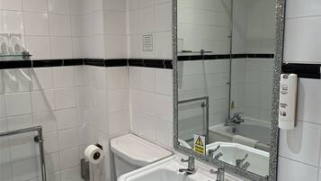 Combined shower/tub, hair dryer, towels, soap