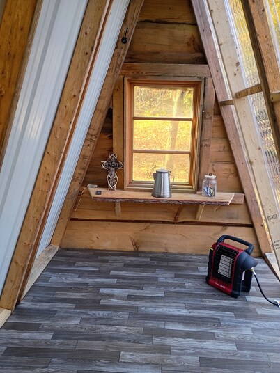 Tiny A frame cabin in the forest