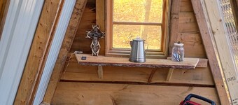 Tiny A frame cabin in the forest