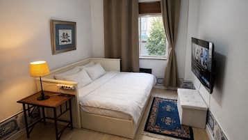 Een strijkplank/strijkijzer, wifi, beddengoed