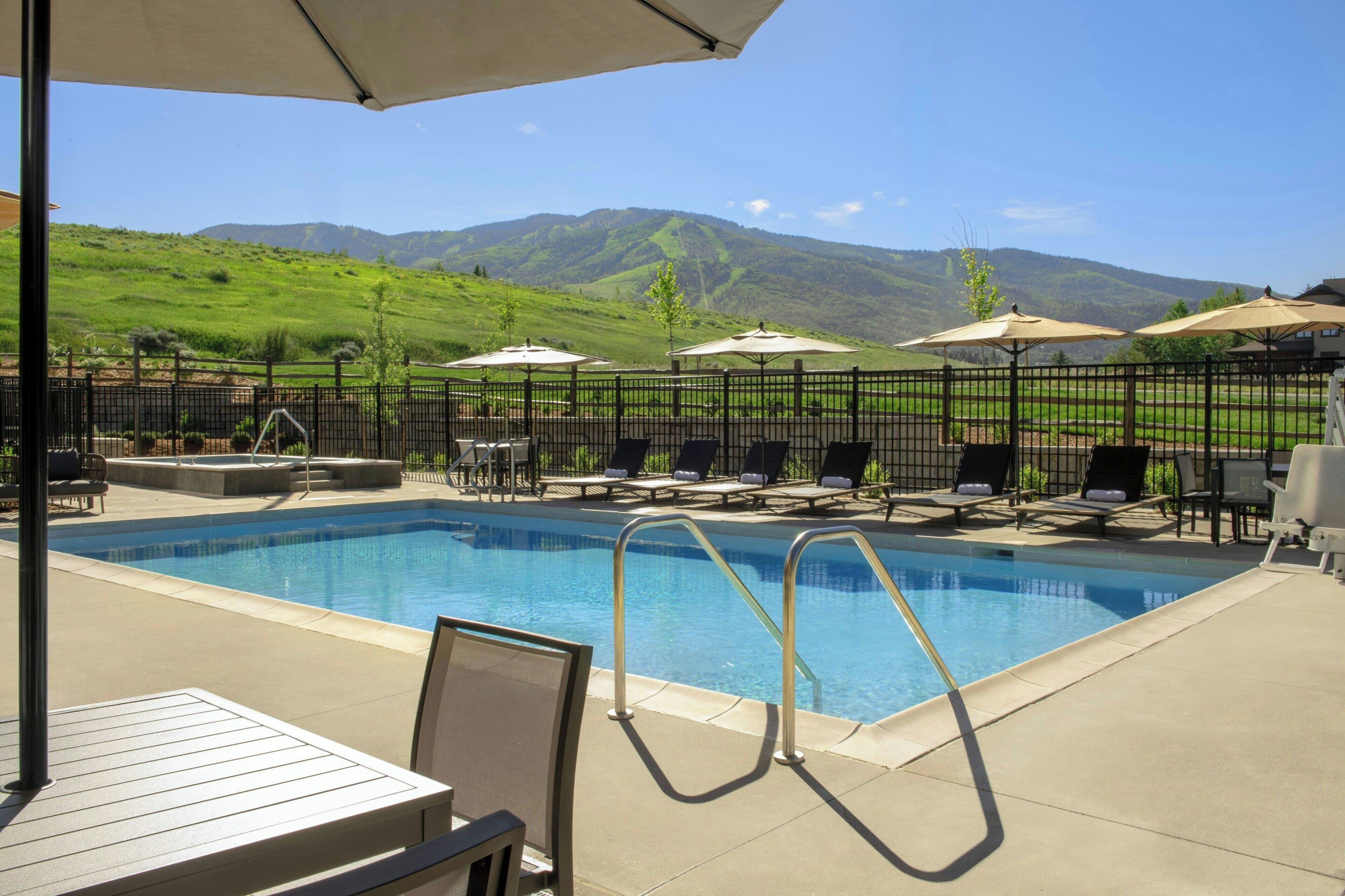 Outdoor pool, pool umbrellas, sun loungers