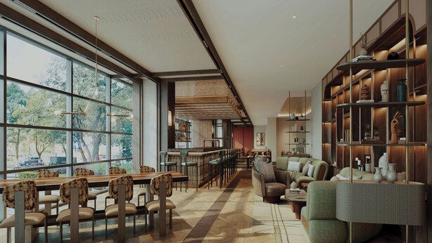 Un intérieur spacieux et moderne, avec une longue salle à manger, des sièges confortables et une grande bibliothèque.