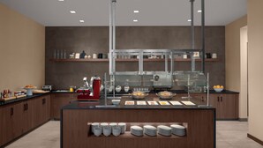 Una cocina moderna con una isla central, armarios empotrados y una vitrina con puertas de vidrio.