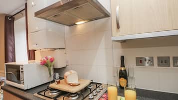 Fridge, microwave, toaster, cookware/dishes/utensils