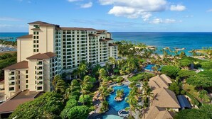 A hotel with multiple buildings, a swimming pool, and a view of the ocean. - Marriott's Ko Olina Beach Club-2 Bedroom Unit-Mountain View-Full Resort Access (Kapolei)