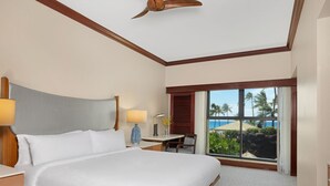 A hotel room with a large bed, a desk, a chair, and a view of the ocean. - Marriott's Ko Olina Beach Club-2 Bedroom Unit-Mountain View-Full Resort Access (Kapolei)