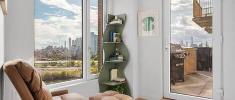 Superior Suite, 3 Bedrooms, Balcony | Living area | 50-inch TV with digital channels