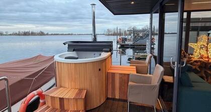 Exclusive Houseboat 12 x 5 m with sauna and hot tub
