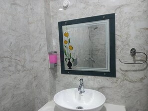 Shower, towels, soap, toilet paper