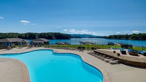 A swimming pool with a view of a lake and mountains. - Smith Mountain Lake Studio | Pool, Beach & Trails (Huddleston)