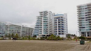 A modern high-rise building with multiple balconies and a flat roof. - Caribbean Retreat, apartment 304 (Cartagena)